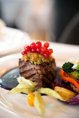Gourmet beef fillet with red currants – fine dining, close-up