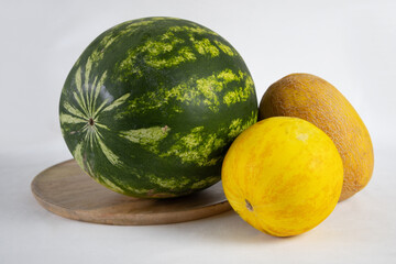 Melon and watermelon on a wooden tray