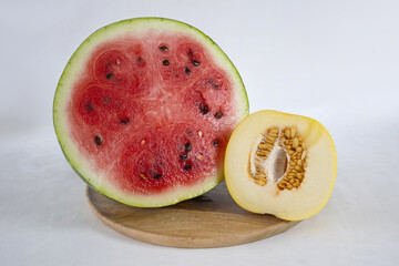 Sliced watermelon and melon on a light background