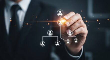 A businessman draws an organizational chart showing team structure and hierarchy within the corporate management system.