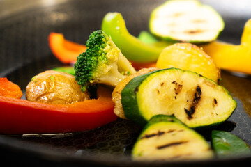 Colorful grilled vegetables in frying pan – close-up