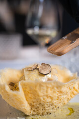 Truffle pasta in parmesan basket – gourmet close-up