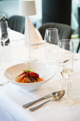 Gourmet seafood soup on elegant restaurant table – front view