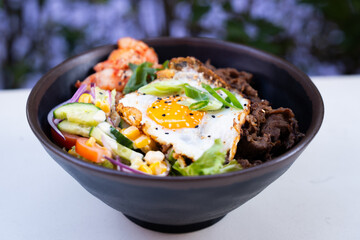Korean beef rice bowl with fried egg – front view