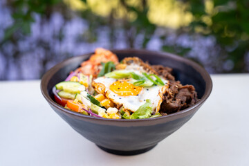 Korean beef rice bowl with fried egg – front view