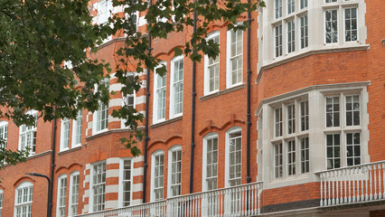 Old red brick English house with traditional architecture and rustic countryside feel