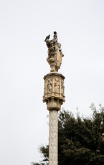 Medieval cross of Sant Antoni standing tall in a public garden in Tarragona, Catalonia, Spain....