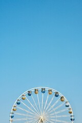 ferris wheel against blue sky