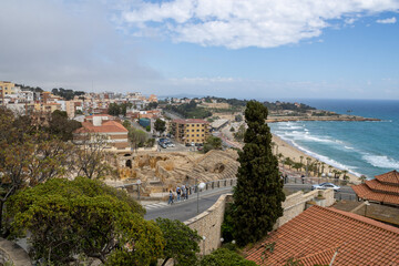 Ancient Roman amphitheater ruins in Tarragona, Catalonia, Spain, overlooking the Mediterranean Sea. Former site of gladiator fights and public spectacles.