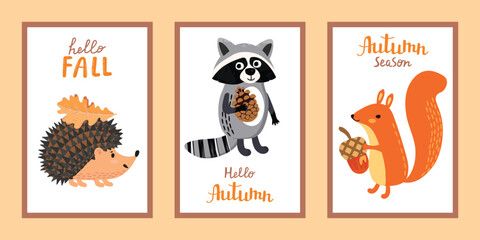 Fototapeta premium Autumn card set with wild animals. Cartoon hedgehog with a leaf, raccoon with a pine cone and squirrel with an acorn. Cute forest characters with lettering on white background. Vector illustration.