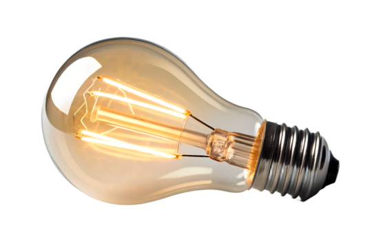 Vintage edison filament light bulb glowing warm light isolated on transparent background