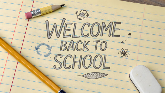 Welcome Back to School Message on Notebook with School Supplies