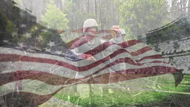 American flag fading and revealing two soldiers pumping shotgun and aiming in military training