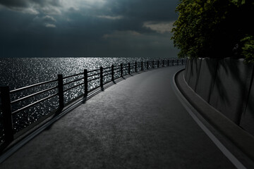 月光がキラキラ海面に反射する夜のガードレールがある海沿いの道
