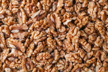 Abundant shelled walnuts displayed as a natural texture background