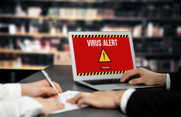 Virus warning alert on computer screen detected brisk cyber threat , hacker, computer virus and...