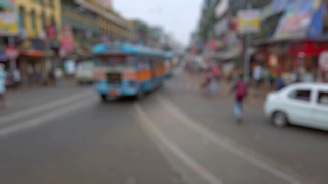 Bokeh view of street traffic in Calcutta, India. Blurred background footage.