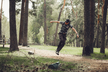 Man Leaping Joyfully in a Forest Setting, Expressing Exuberance