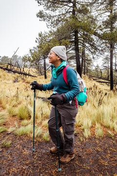 Hiker exploring a rainy trail with determination