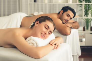 Caucasian couple customer enjoying relaxing anti-stress spa massage and pampering with beauty skin...