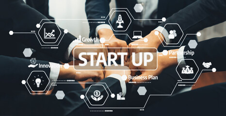 A group of diverse individuals uniting their hands, symbolizing collaboration and innovation in a...