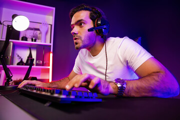 Smart gaming streamer talking with team member players using headset and mic for communicate with...