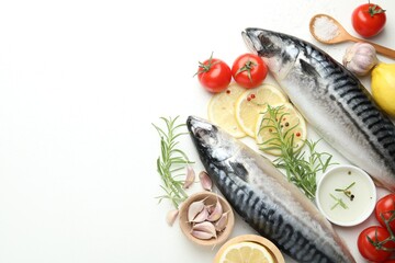 Seafood delicacies. Fresh raw mackerels and spices on white table, flat lay. Space for text