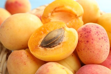 Many fresh apricots on light background, closeup