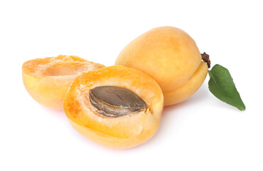 Fresh ripe apricots with green leaf isolated on white