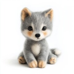 Fototapeta premium Adorable plush wolf toy with gray fur sitting on white seamless backdrop