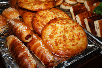 Varied assortment of hot delicious bakery and freshly baked goods. Selling food products at a street fair. Street food to go. Fast food. Traditional Ukrainian dishes of national cuisine.	