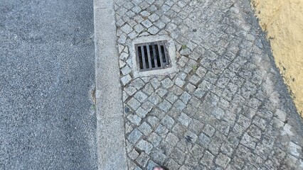 Cobblestone Sidewalk with Street Drain and Curb