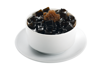 a cup of black and brown sugar on a saucer