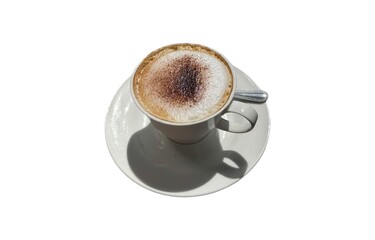 A cappuccino sits on a saucer against a white background, casting a shadow.
