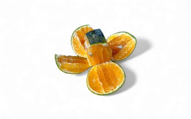 A vibrant, sliced orange fruit arranged on a clean white background, showcasing its juicy segments.