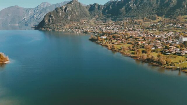 Aerial view of Lake Idro, surrounded by lush Italian mountains and peaceful lakeside villages