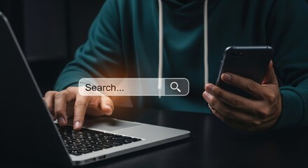 A person is searching online using a laptop and phone, navigating the digital world for information and connection