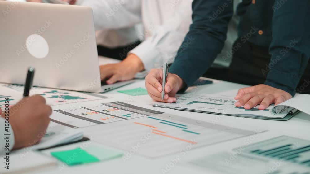 Poster a dynamic business meeting scene with diverse individuals engaged in analysis, reviewing reports, an