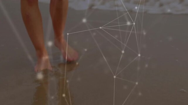 Bare feet starting surf swirling around ankles and overlay mapping leg movement along shoreline