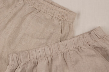 Natural beige color linen clothes. Top view