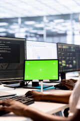 System administrator in server hub ensuring data remains shielded from potential threats using...