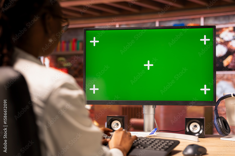 Poster freelancer in apartment office using green screen pc display to work on job tasks. close up shot of 