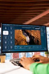 Man at home using generative artificial intelligence website generating videos using diffusion...