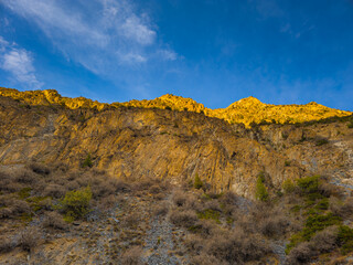 Majestic mountain landscape with rocks and lush vegetation in Kyrgyzstan
