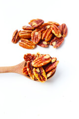 Delicious salted pecan nuts scattered.