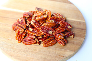 Delicious salted pecan nuts scattered.