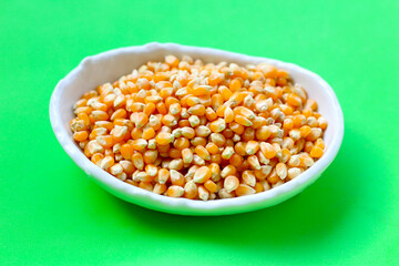 Yellow raw unpopped popcorn kernels
