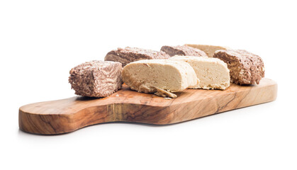 Halva with cocoa. Sweet oriental dessert on cutting board isolated on white background.