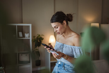 beautiful woman use mobile phone and credit card for online shopping