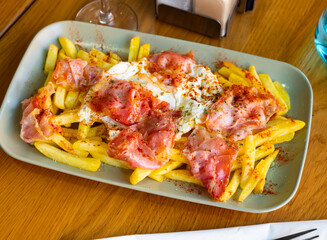 three eggs and fried bacon are on blue dinner plate